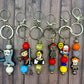 Spooky Circus Beaded Keychains Featuring Dancing and Clown Characters